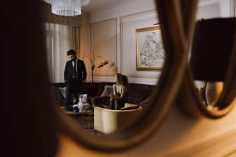 A couple in a luxurious hotel lounge, reflecting elegance and style.
